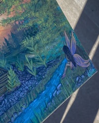 a painting of a fairy with a stream in the background