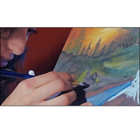 a woman is painting a picture of a wolf