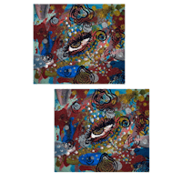 a pair of colorful square coasters with an eye on one side and a flower on the other